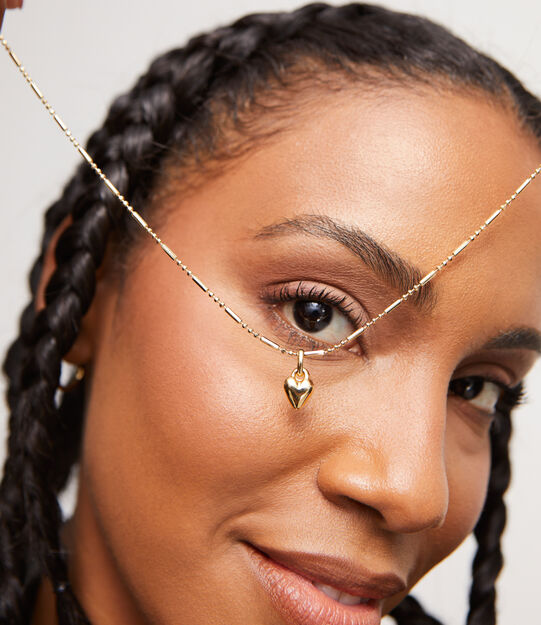 18K gold-plated heart-shaped charm.